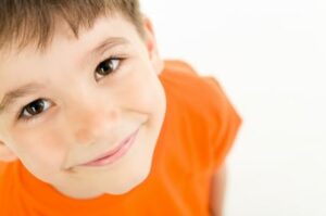 Image of a happy and smiling little boy, Darcy, who is undergoing homeopathic treatment for autism.