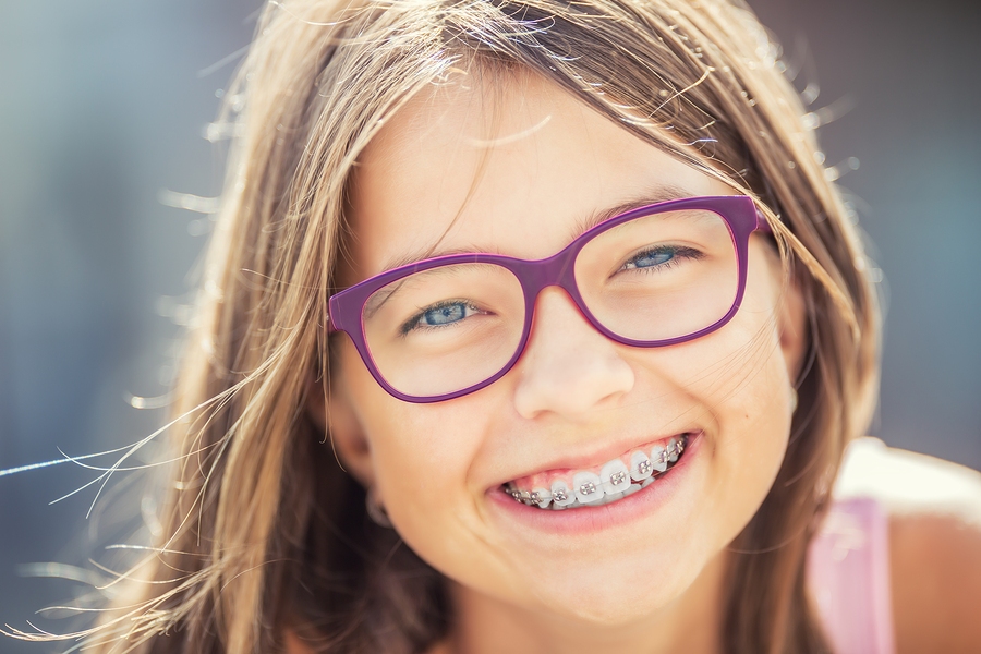 A young girl with braces